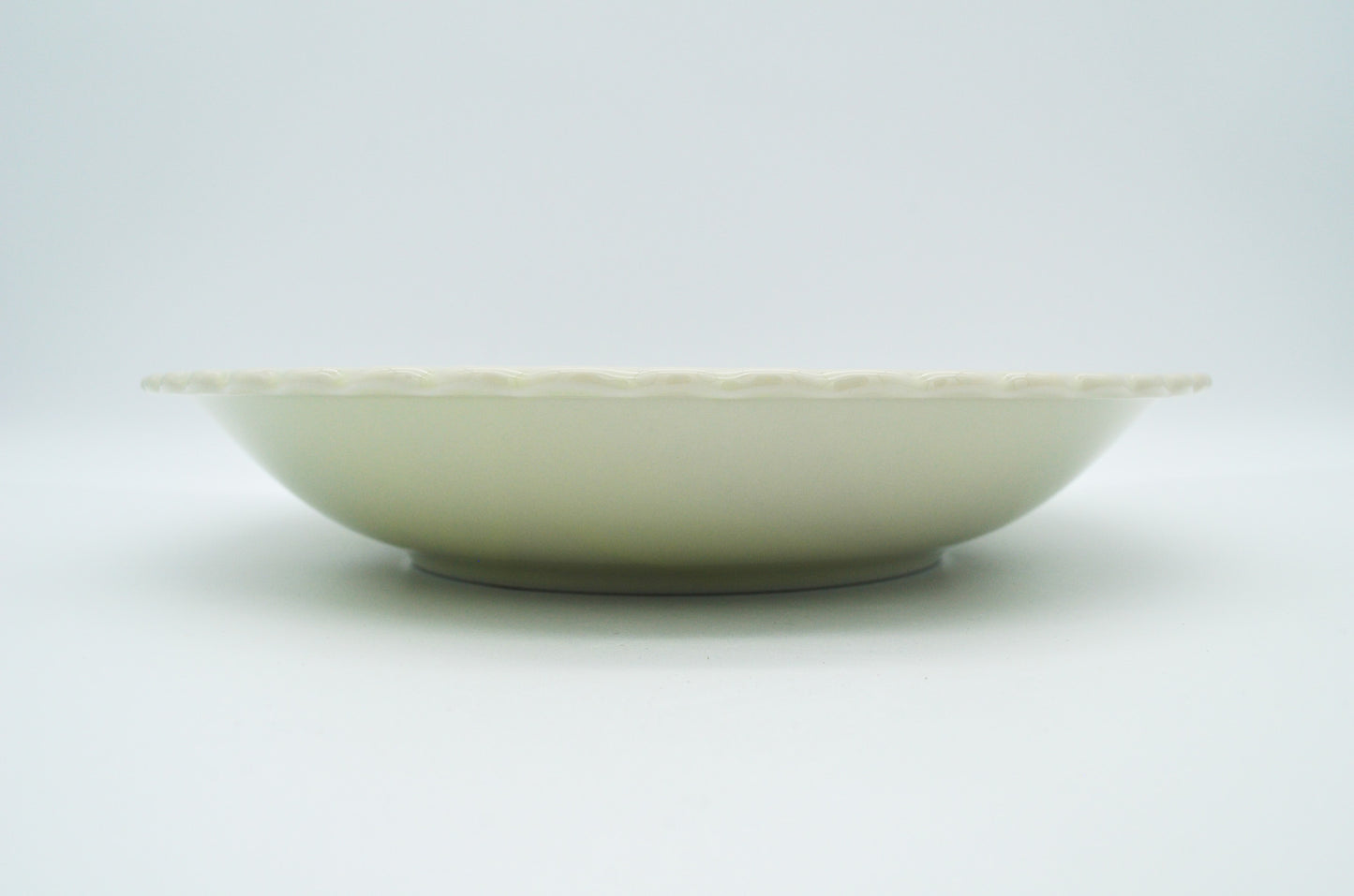 White ceramic bowl on a light gray background