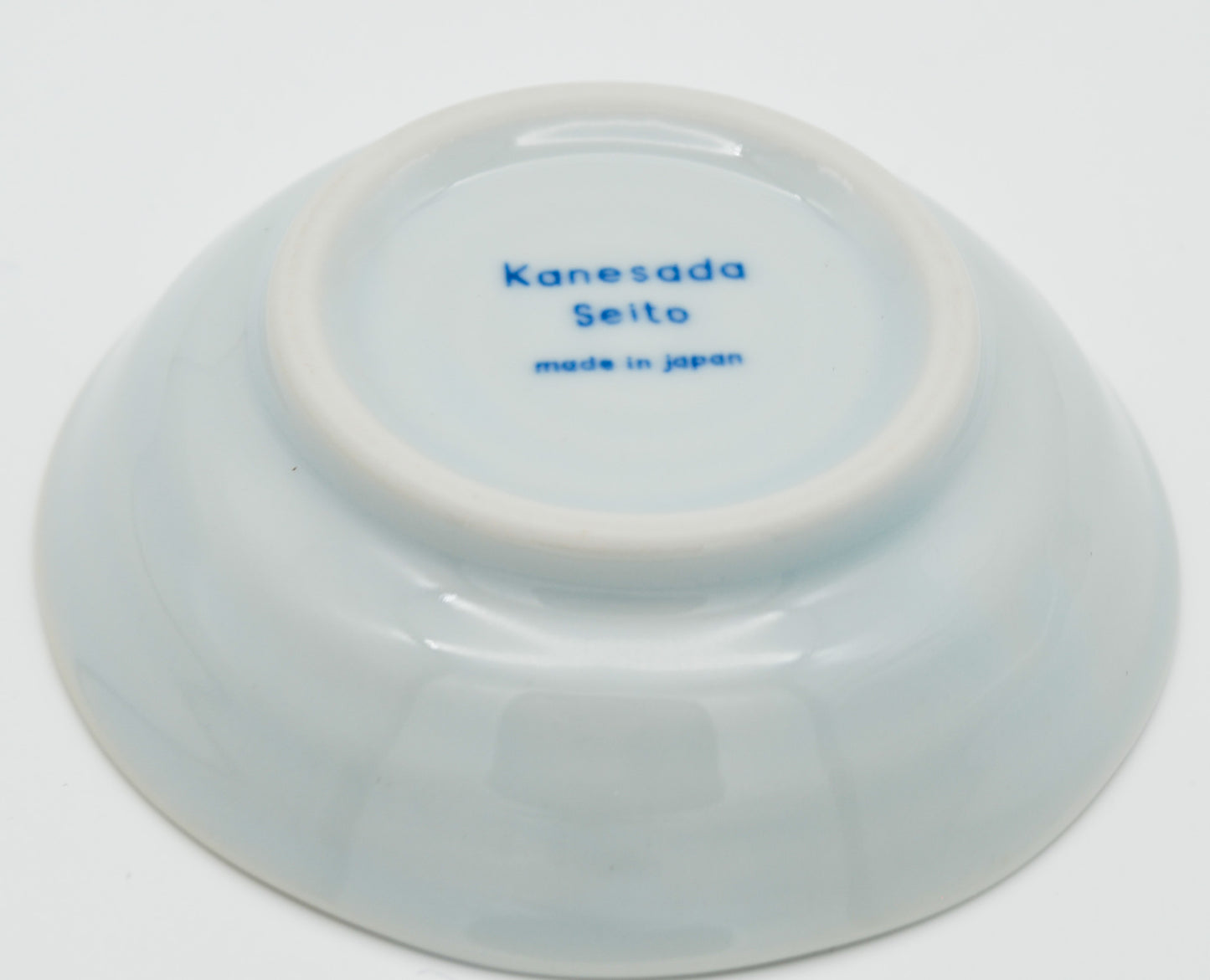Ceramic bowl with 'Kanesada Seito made in Japan' text on a white background