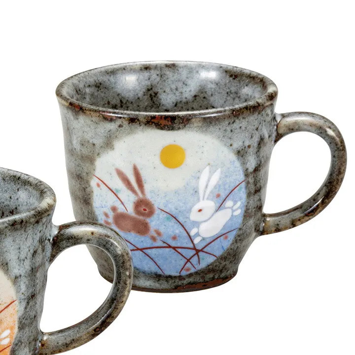 Ceramic mug with rabbit design on a white background