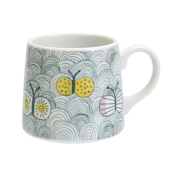 Mug with a butterfly and wave pattern on a white background