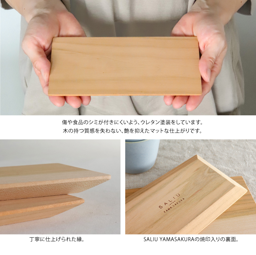 Wooden block held by hands with close-up details on a neutral background