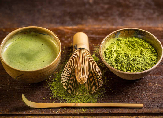 Matcha green Tea with matcha whisk, spoon and green tea powder