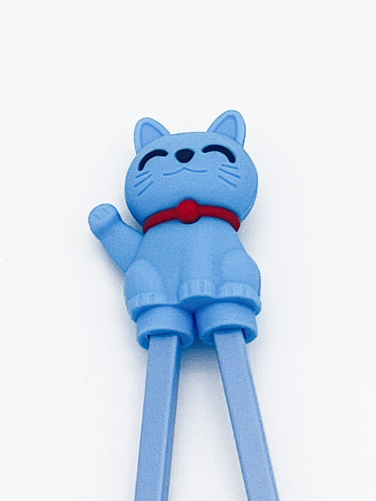 Blue cat-shaped chopstick rest on a white background