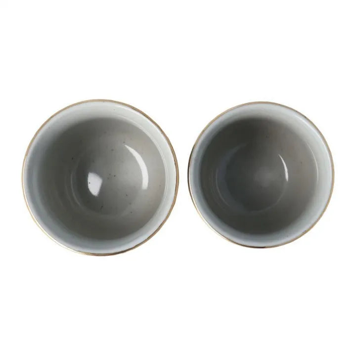 Inside the ceramic tea cups on a white background