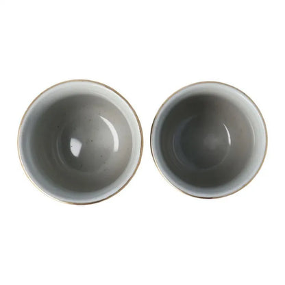 Inside the ceramic tea cups on a white background