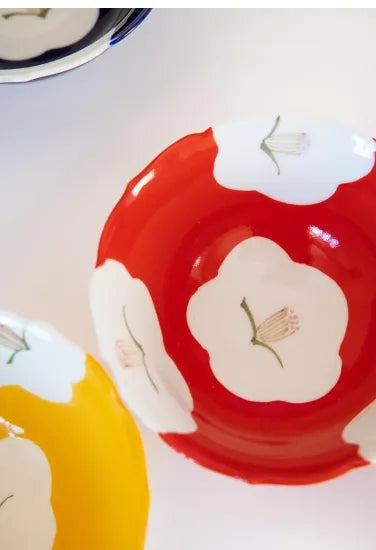 Decorative bowls with floral designs on a light background. Japanese Ceramics. Made in Japan.