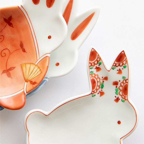 Decorative ceramic plates with abstract designs on a white background