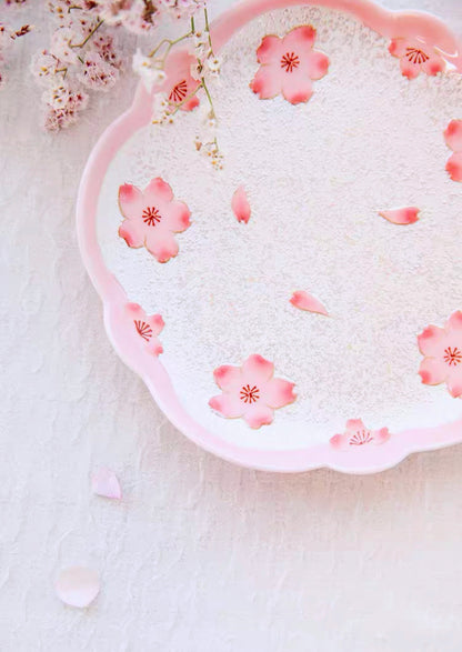 Decorative plate with pink floral patterns on a light background