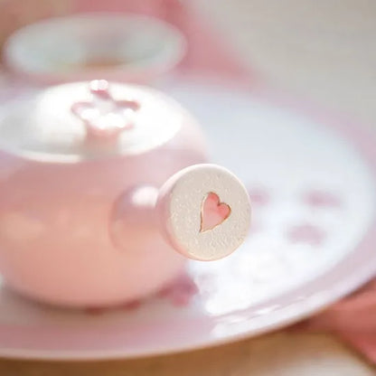 Small round object with a heart design on a blurred background