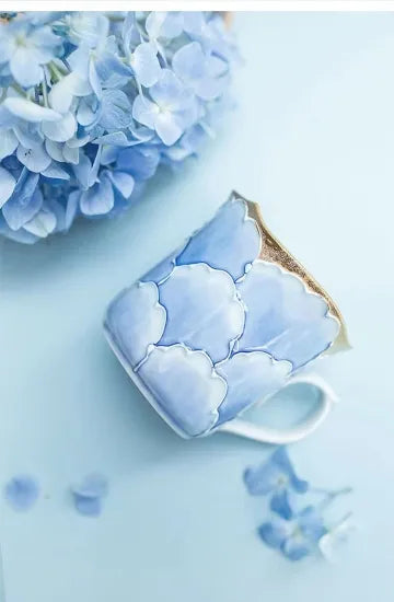 Made in Japan Blue marbled mug with hydrangeas on a light blue background