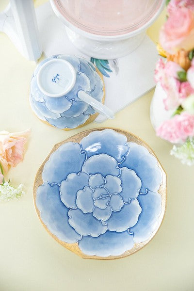 Decorative cookie with blue floral design on a light surface
