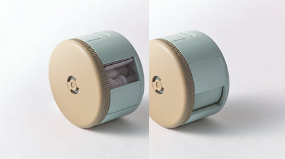 Two views of a cylindrical pencil sharpener with a beige top and green body on a white background.