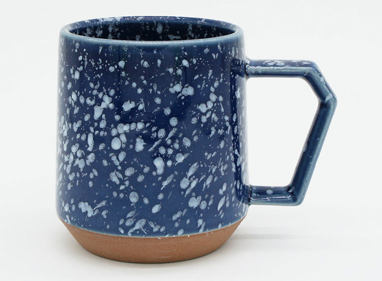 Blue speckled mug with a brown base on a white background. Japanese Ceramic. Made in Japan