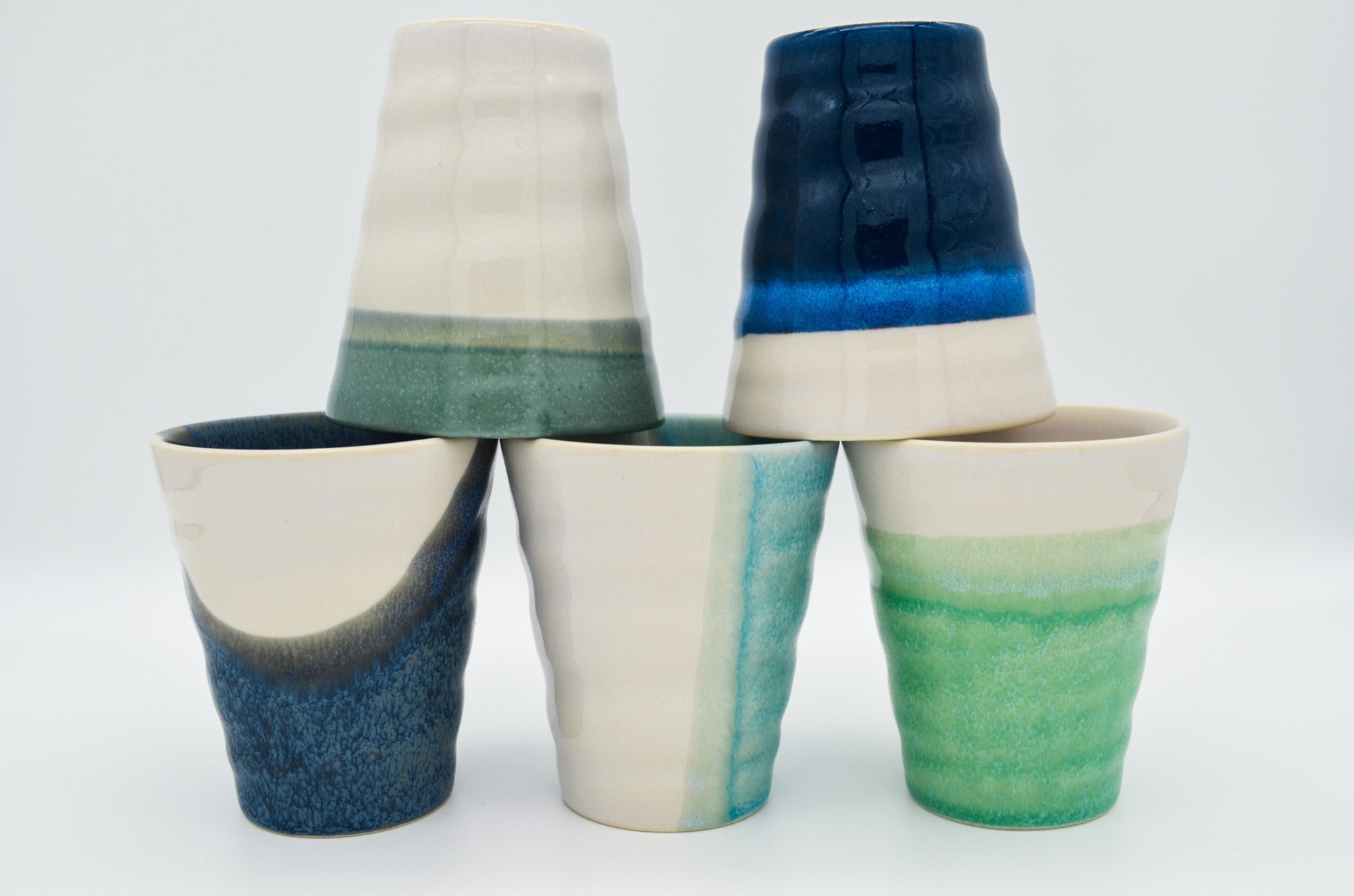 5 cups in green, blue and white colours in seascape glazes