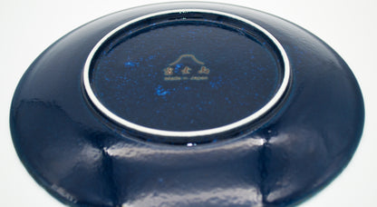 Navy blue ceramic plate with a logo on a white background