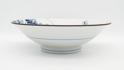 White bowl with blue patterns on a white background