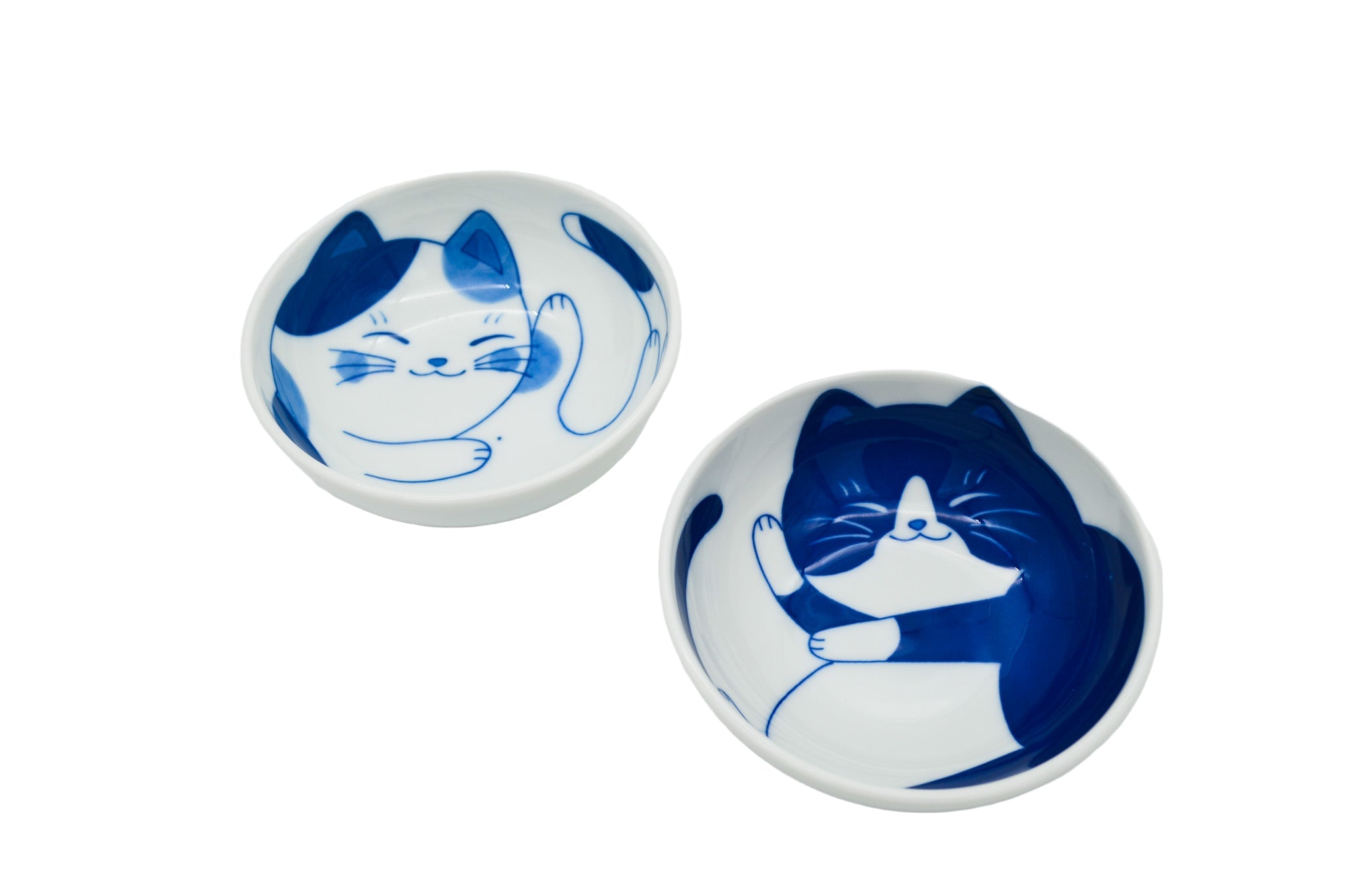 Two ceramic bowls with blue cat illustrations on a white background