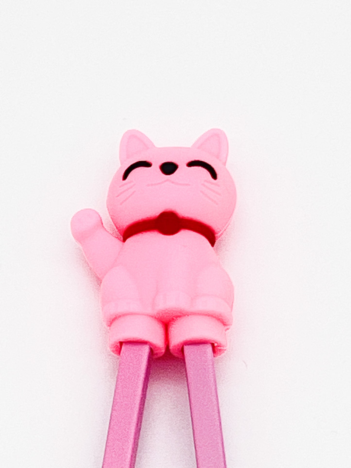Pink cat-shaped chopsticks on a white background