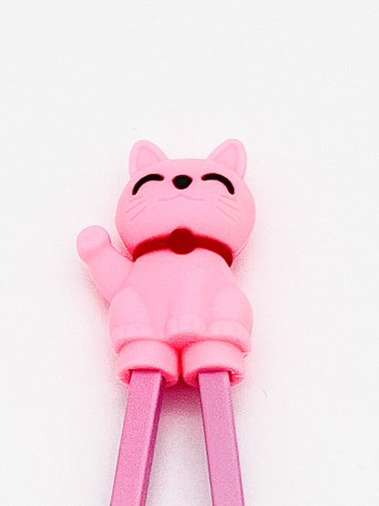 Pink cat-shaped chopsticks on a white background
