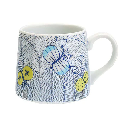 Mug with blue butterfly and yellow flower design on a white background
