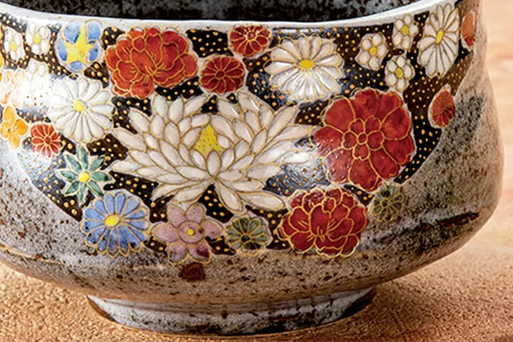 Ceramic bowl with floral patterns on a wooden surface