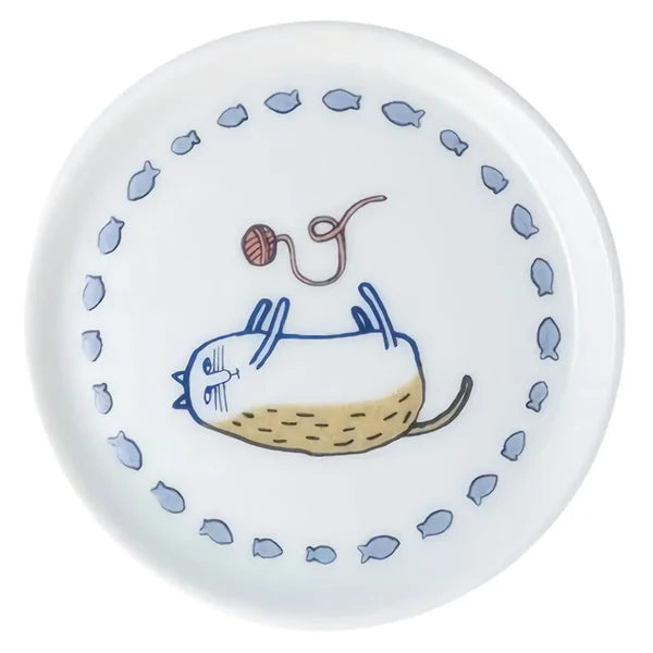 Round ceramic plate with a cat illustration and fish patterns on a white background