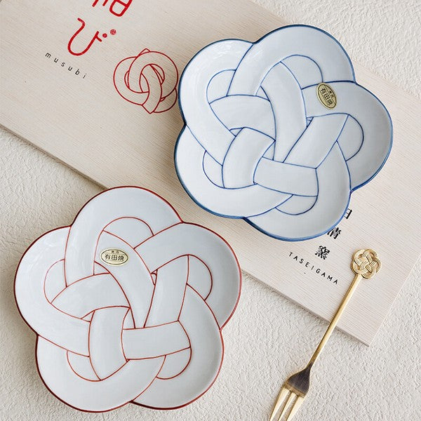 Two decorative plates with knot design on a light surface, featuring the brand 'Taseigama'. Japanese Ceramics. Made in Japan.