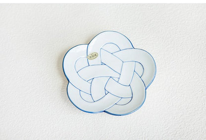 Decorative pillow with a plum knot design on a white background. Japanese Ceramics. Made in Japan.