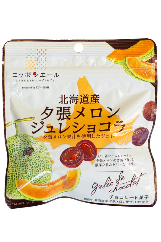 Packaging of a Japanese dessert product with melon and chocolate elements on a white background