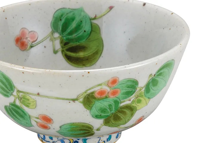Ceramic bowl with floral designs on a white background