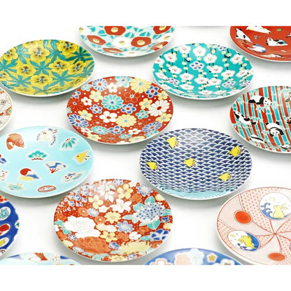 Collection of colorful patterned plates on a white background