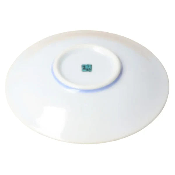White round device with a small blue light on a white background