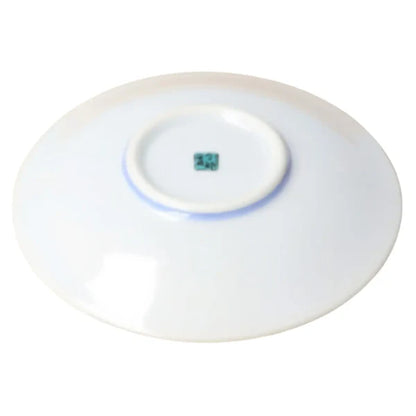 White round device with a small blue light on a white background