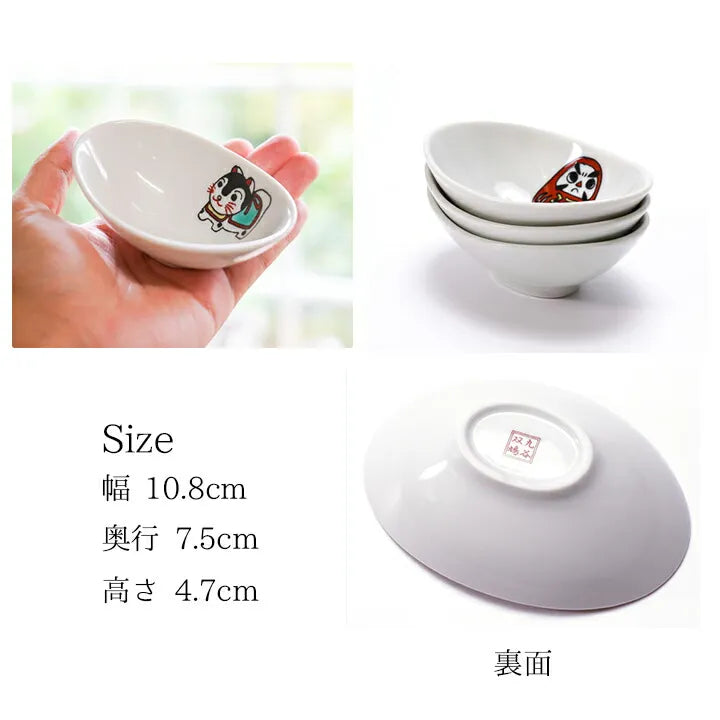 White ceramic bowl with cartoon character design, held by a hand, and stacked on a white surface.