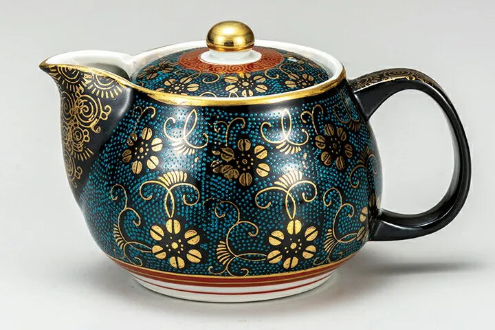 Decorative teapot with floral patterns on a white background