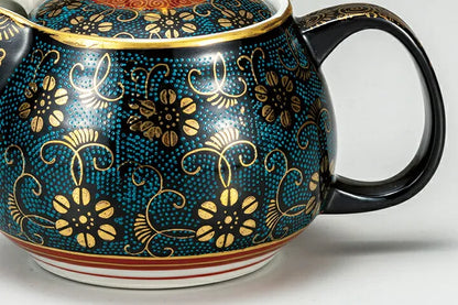Decorative teapot with floral patterns on a white background
