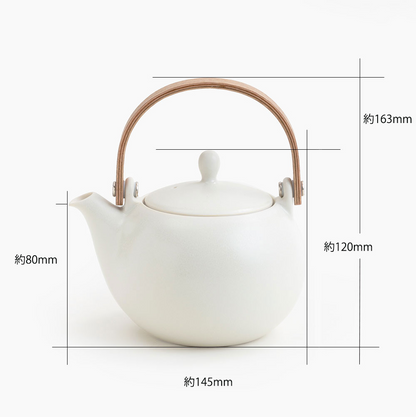 White teapot with wooden handle and dimensions labeled on a white background