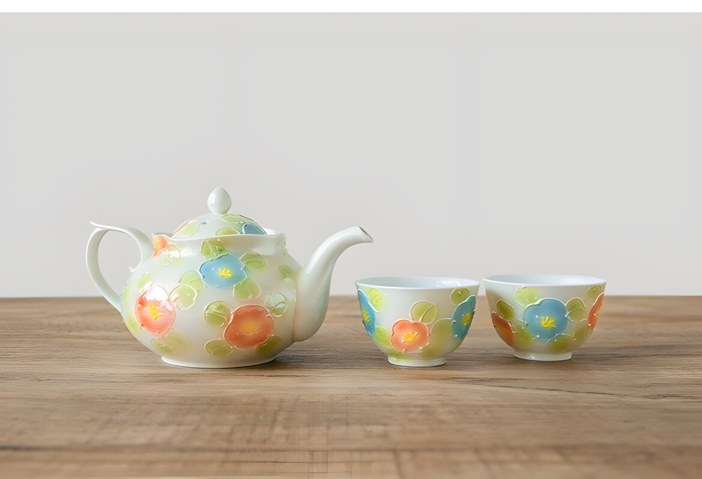 Ceramic cup with floral design on a wooden surface