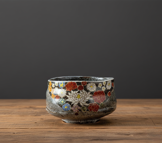Ceramic bowl with floral patterns on a wooden surface